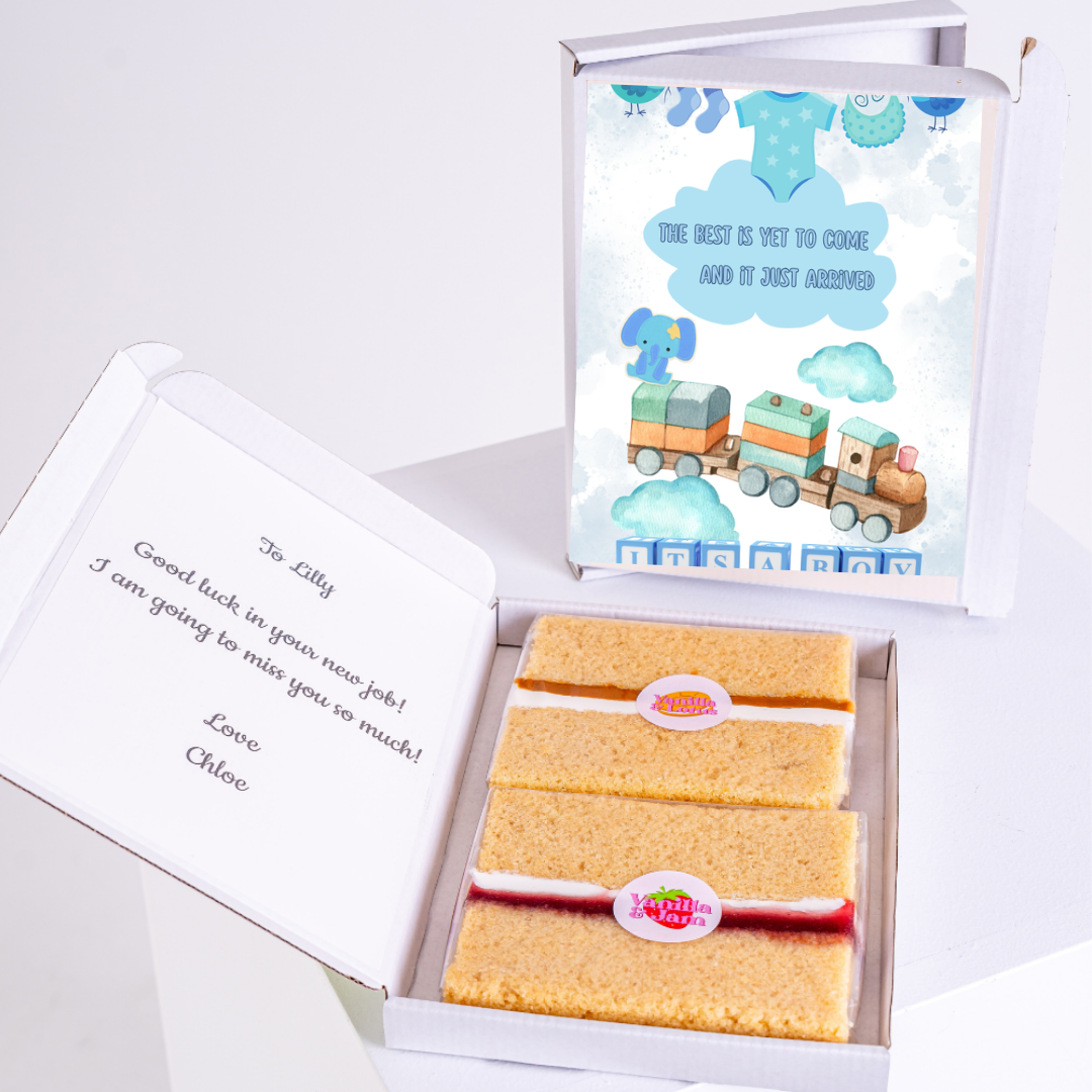 Baby shower cake box with train and baby clothes design