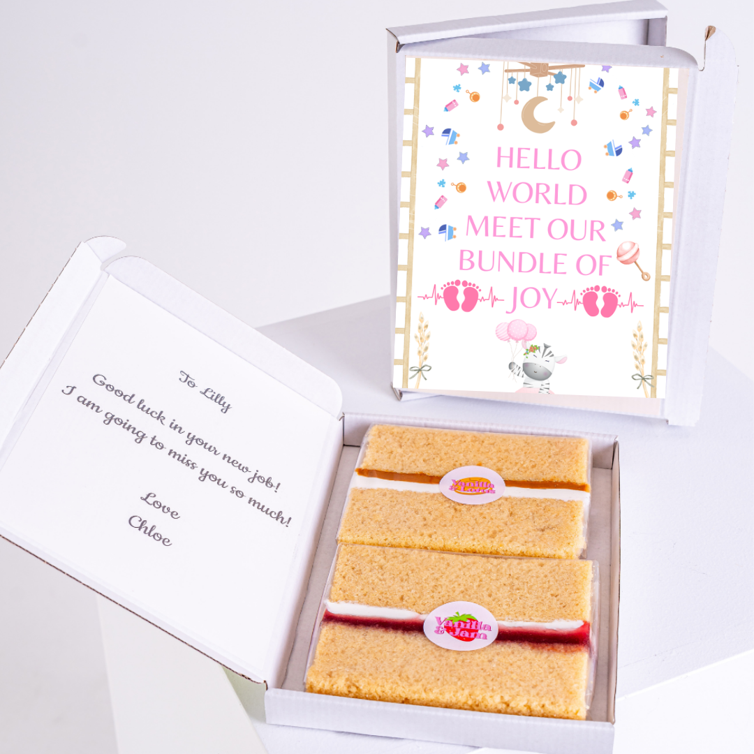 Baby gift box with cake, Hello World card, and message to Lilly.