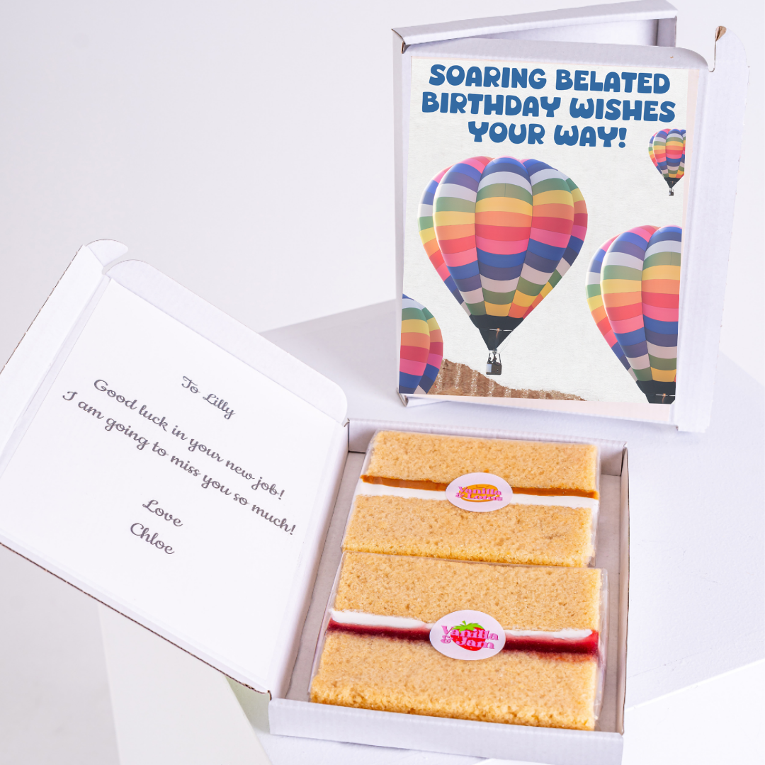 Belated birthday wishes gift box with cake and card.