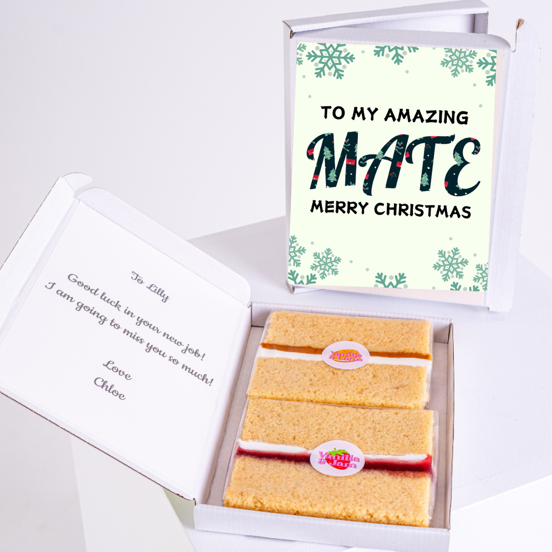 Christmas gift box for a new job with cake and a card.