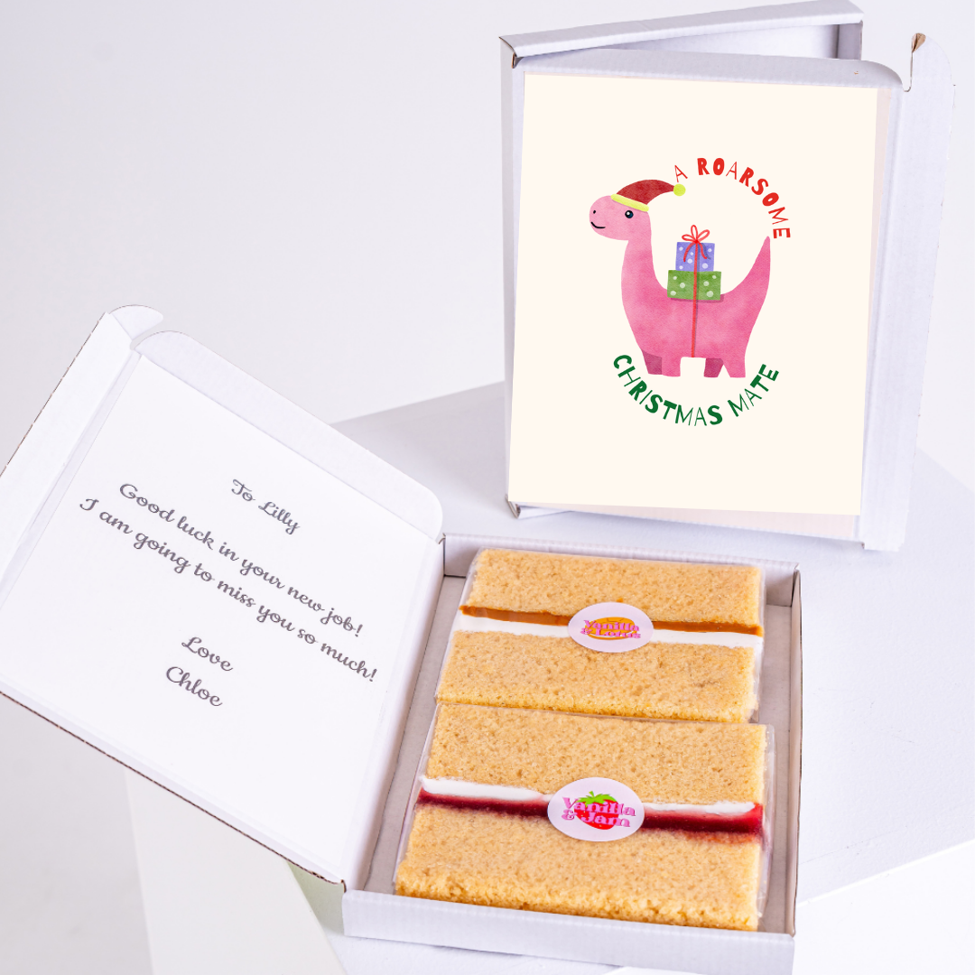 Christmas gift box with cake and dinosaur card, sent to Lilly.