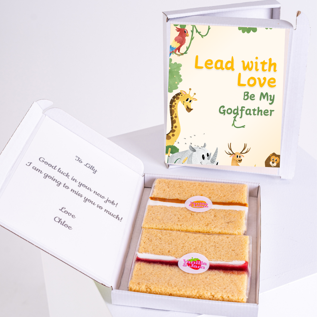 Gift box with Lead with Love, Be My Godfather card and cake.