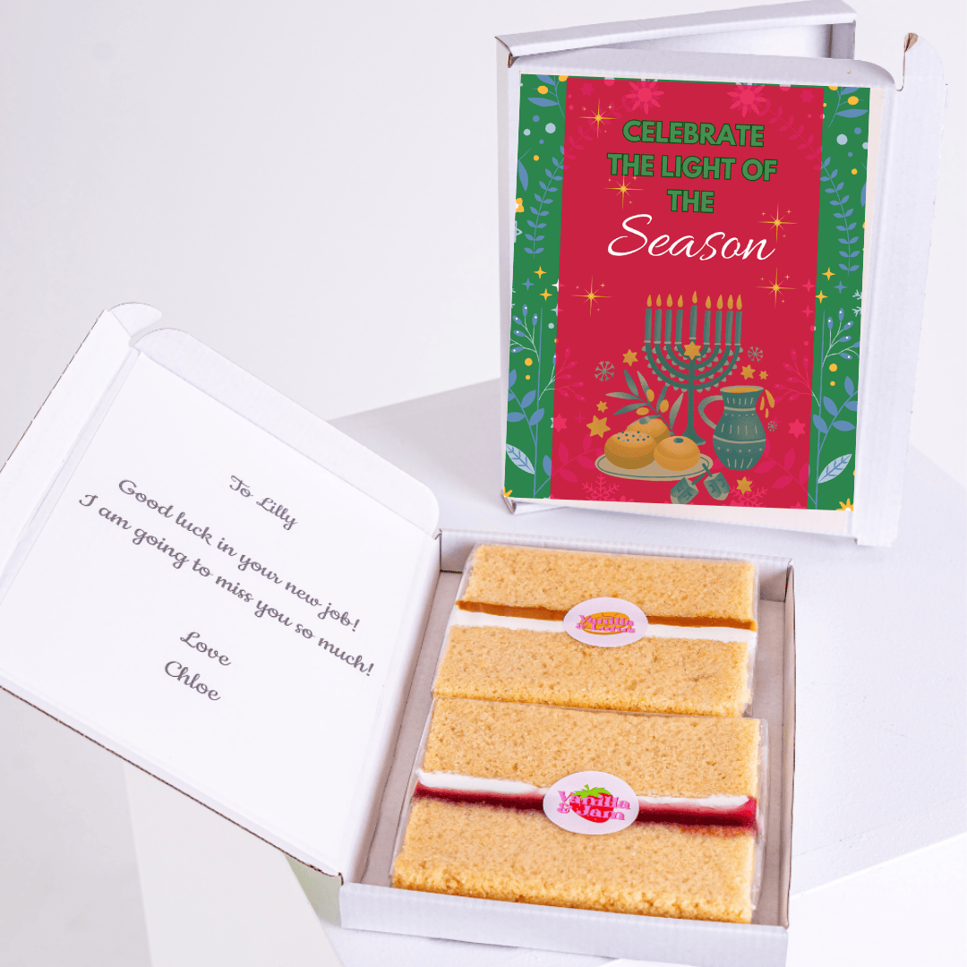 Gift box with Celebrate the Light of the Season card and cake.