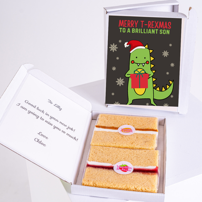 Christmas gift box with dinosaur card and cake.