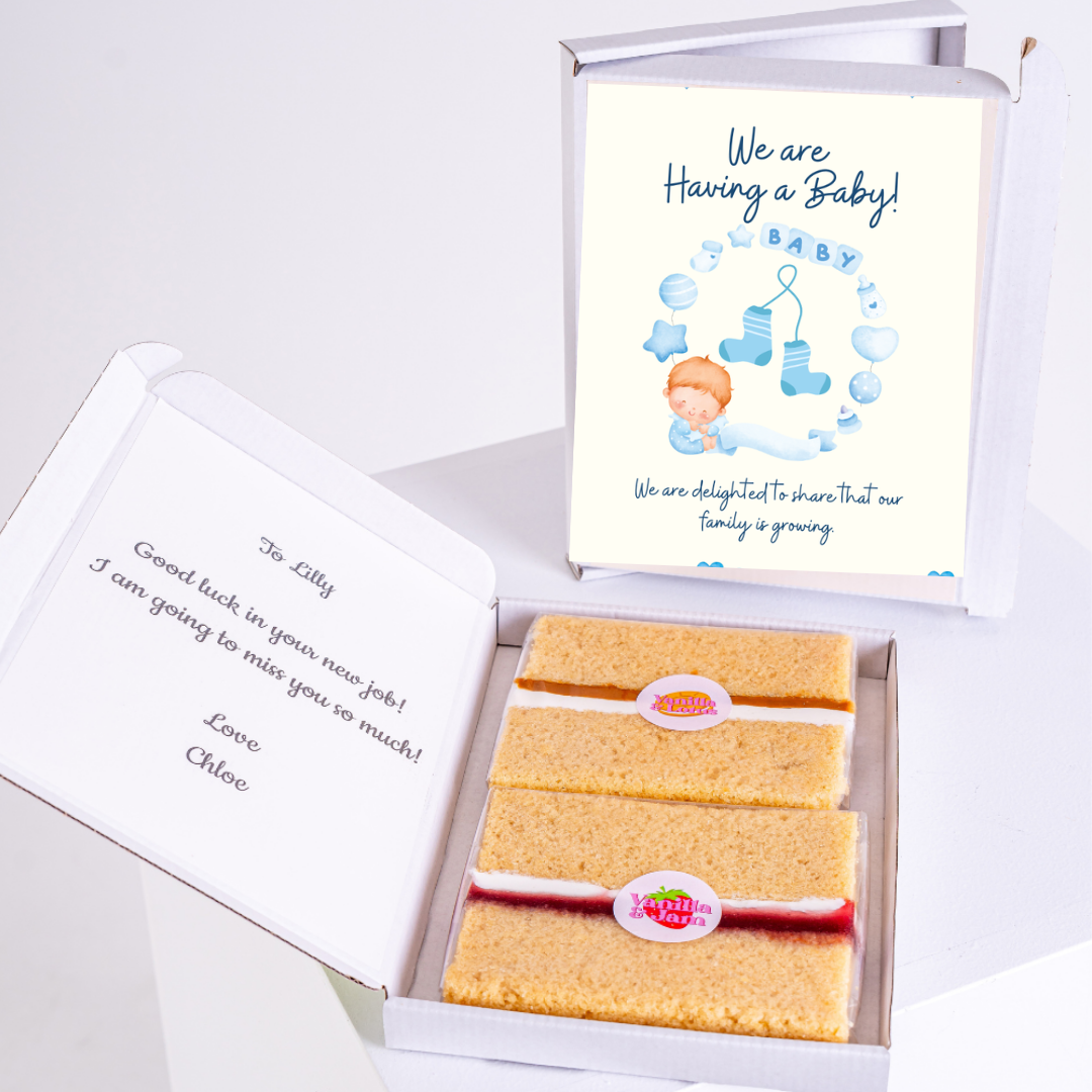 Baby announcement gift box with cake, note, and card.