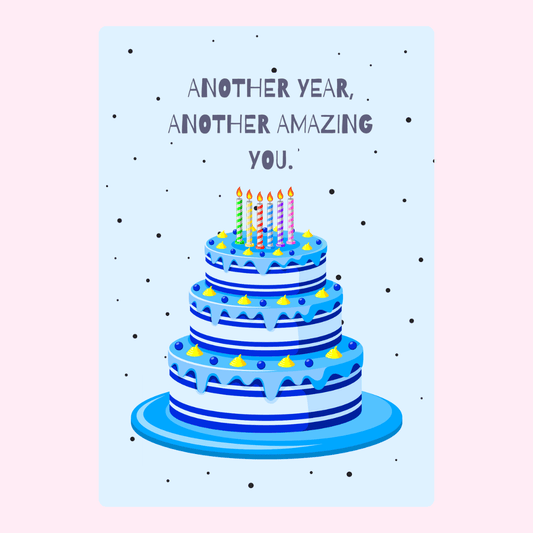 Three-tier blue birthday cake with candles and “Another year, another amazing you” message on a soft background