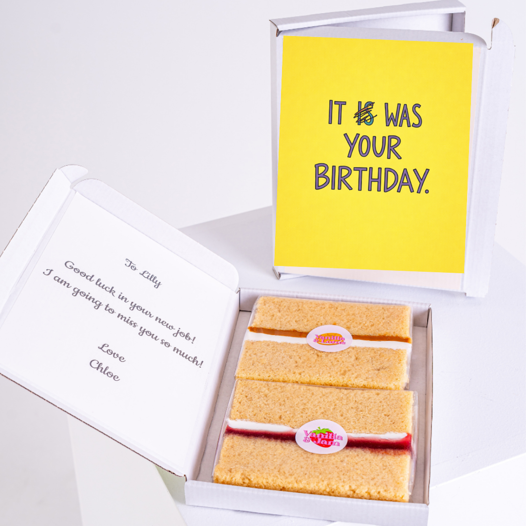 A humorous belated birthday card with the message "It was your birthday" in a bold and playful style, with crossed-out "is" and checked "was" to mark the late wish.