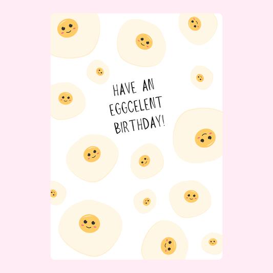 Funny birthday card with smiling eggs and text Have an eggcellent birthday on grey background