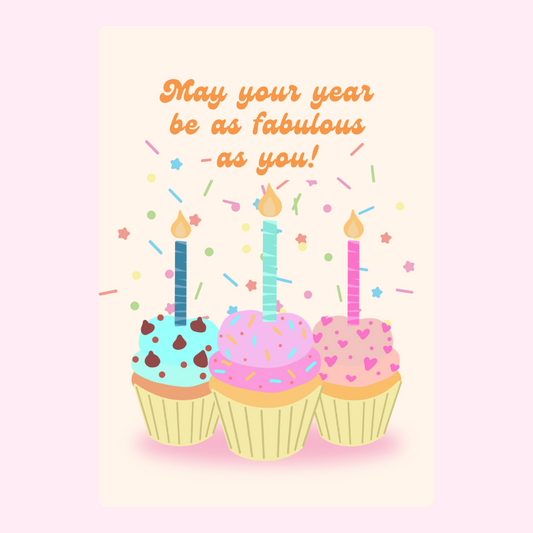 Colorful cupcakes with candles and confetti with “May your year be as fabulous as you!” birthday message on a soft background
