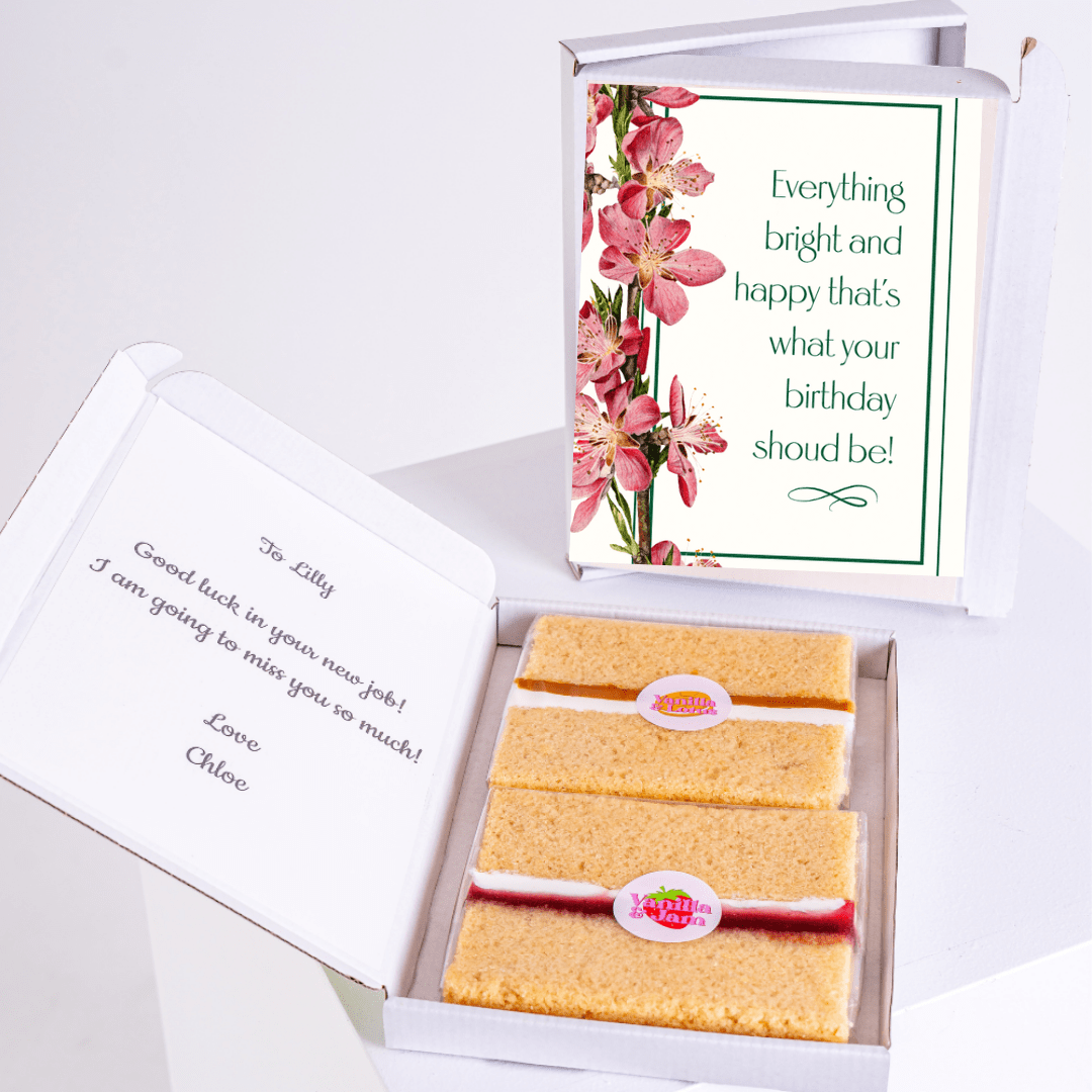 Floral spring birthday cake gift box with pink blossom artwork and thoughtful birthday message