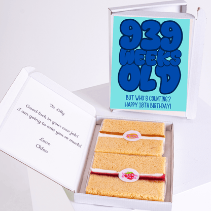Funny 18th birthday cake card box with “939 weeks old” design and mini cake slices inside