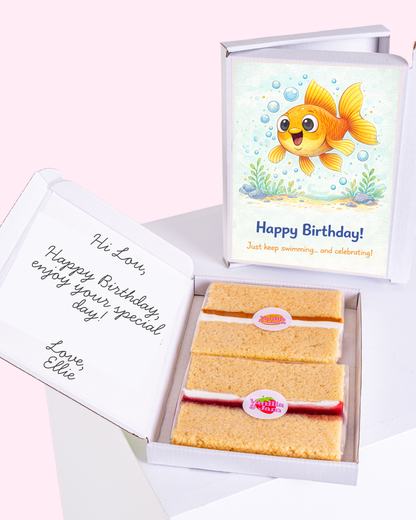 Birthday gift box with cake slices and cute goldfish birthday card inside