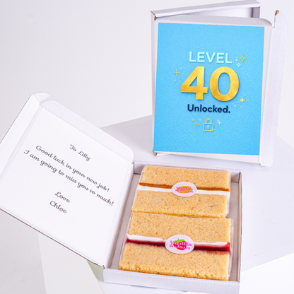 level 40 unlocked birthday cake card with blue background and gold number design