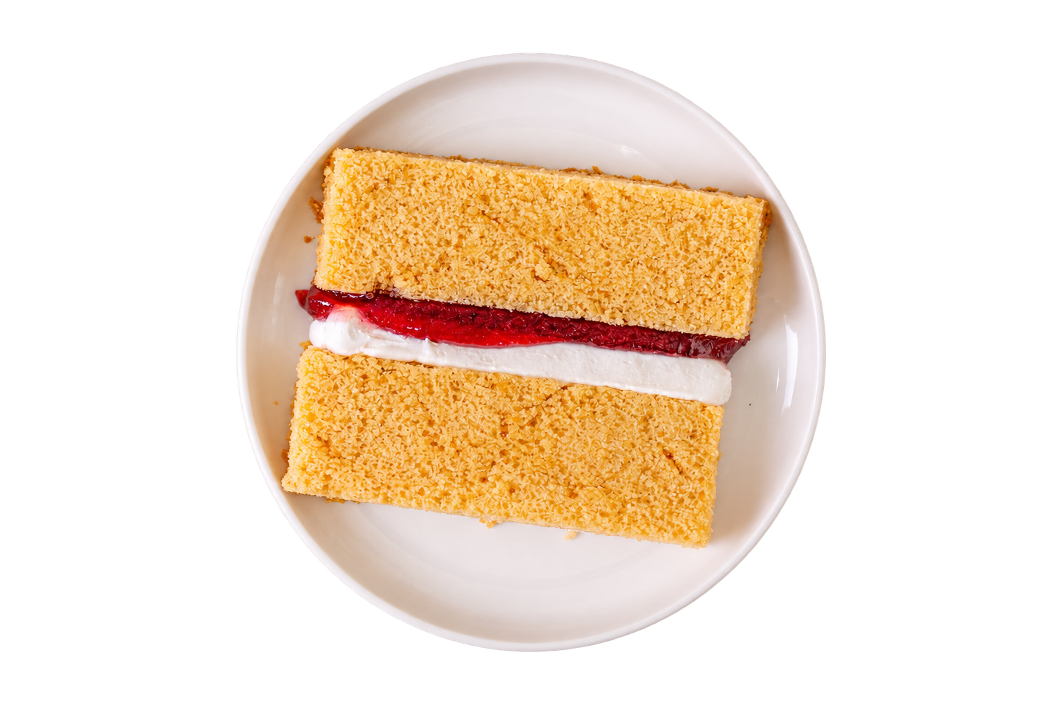 A vanilla sponge cake slice with jam and cream filling on a plate