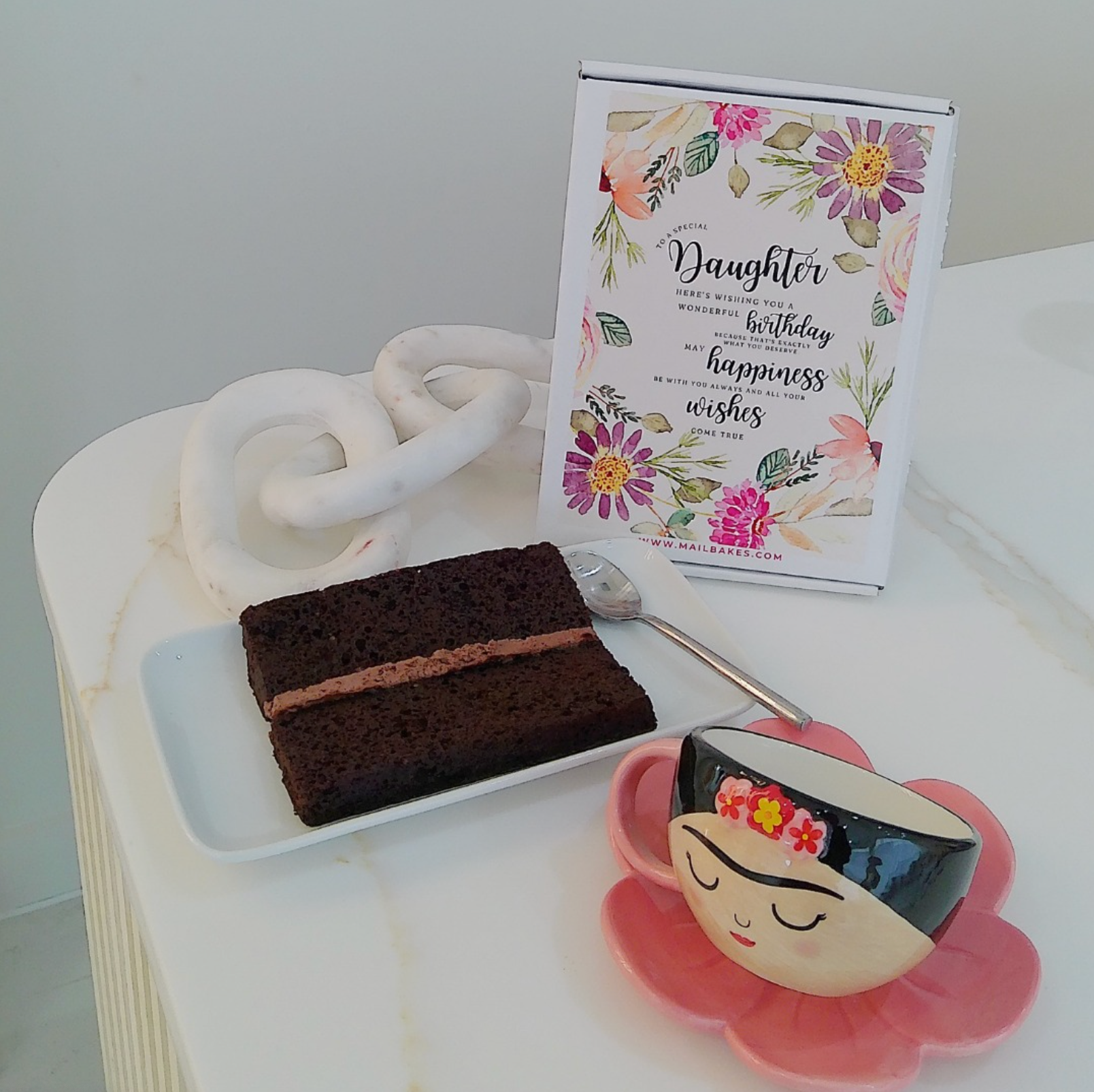 Chocolate cake slice, birthday card, & Frida Kahlo teacup