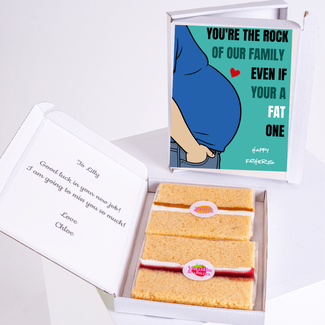 Funny Father's Day gift box featuring 'You're the Rock of Our Family Even If You're a Fat One' cake card